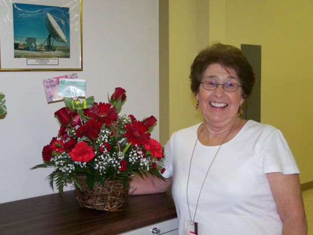 Standing with the flowers