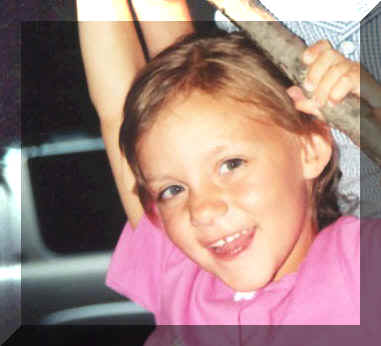 Megan climbing a tree