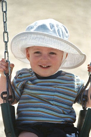 Sean on the swings at Myrtle Beach